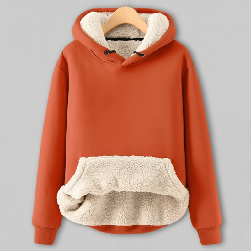 Orange hoodie with cream sherpa fleece lining, featuring a drawstring hood and a large cozy front pocket.