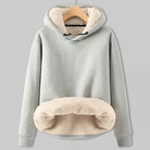 Gray hoodie with cream sherpa fleece lining, featuring a drawstring hood and a large cozy front pocket.