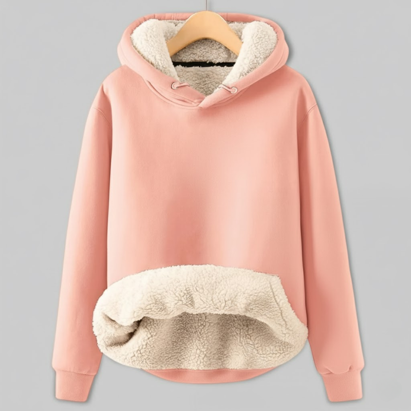Soft pink hoodie with cream sherpa fleece lining, featuring a drawstring hood and a large cozy front pocket.